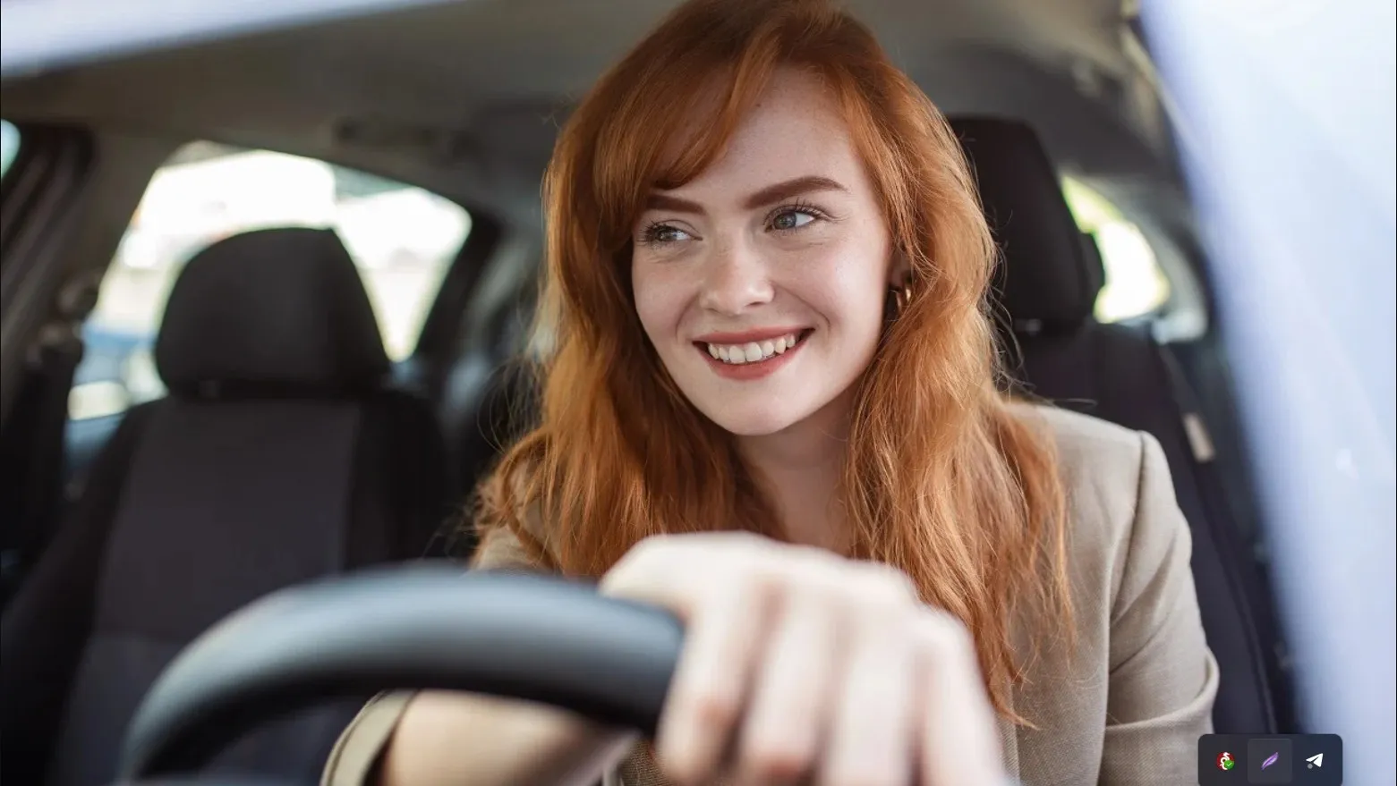 Driver fastening a seatbelt in a car